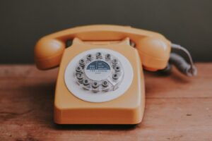 orange-analog-phone-on-tabe